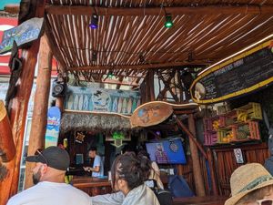 View of the restaurant, no indoor seating, but a few covered outdoor tables. at The Surfin Burrito in Cancun