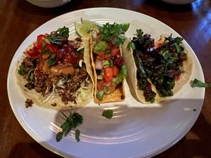 Platter of three “vegetarian” tacos on menu, all made vegan. L to R: cauliflower, chorizo, beet. 😋   at Barrio in Seattle