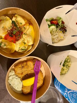 Schnitzel, ravioli and some sides (potato salad, some other greens/salad) at Max Pett in Munich