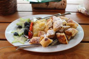 cut-up and sugared pancake with fruits at Max Pett in Munich