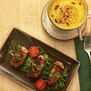 Mozzarella, eggplant, pesto. House made peanut milk with turmeric  at Max Pett in Munich