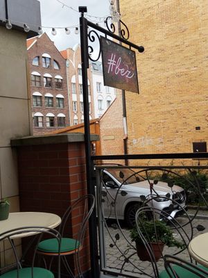 Sitting area and sign at #bez in Elblag