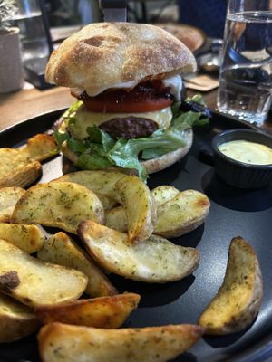  Vegan burger with vegan mayo and vegan cheese, mushrooms, lettuce, tomato, sauce bio chutney/jam red pepper, and onion. With fries instead of salad   at Idees Art Cafe & Shop in Kastoria