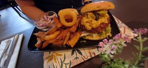 Lamb burger with chips and onion rings at The Queen Inn in Cwmbran