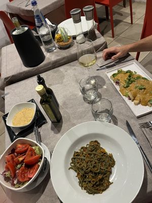 Spaghetti Spirulina with soy ragout and nutritional yeast. And Seitan Carpaccio with no-tuna sauce.  at L'M Ristopizza in San Pantaleo