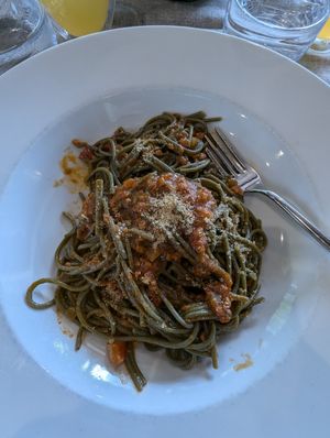 Spaghetti Spirulina with soy ragu at L'M Ristopizza in San Pantaleo
