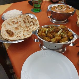 In the foreground: vegan aloo gobi, roti and rice at Buddha in Plzen