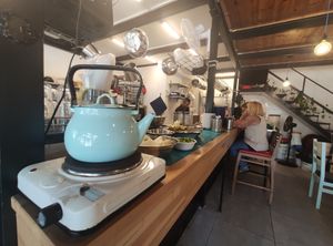 Help yourself to black coffee at Humus Nechama in Haifa