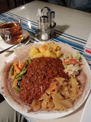 I think this is called "Misir Wot", lentils & mixed vegetables served with injera bread, yum! at Äthiopisches Restaurant in Vienna
