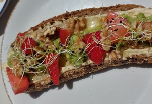 Avocado hummus toast with walnuts and strawberries at Enxalao in San Sebastian