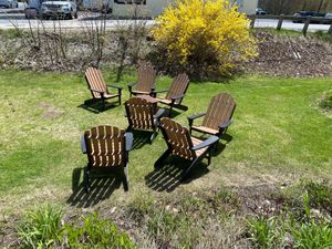 Sunny outdoor seating and forsythias at Grounds in New London