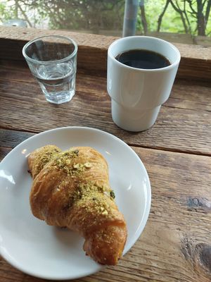 Vegan pistachio croissant and filter coffee. at Moko in Warsaw