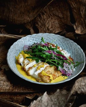 VEGAN KATSU CURRY
Breaded tofu with gluten free bread crumb, coconut steam rice, vegan curry sauce and mix fresh herbs
 at Pistachio in Ubud