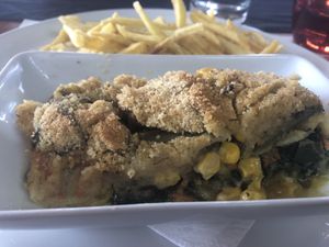 Spinach lasagna and homemade French fries   at O Branquinho in San Jorge