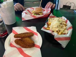 Smoky burger, chicken tenders and Ceaser fries at Hank's  Dirty Colchester in Colchester