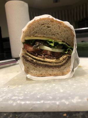 Unreal deli turkey&steak, cheese, “honey” mustard, veg on a wheat hero #Veganuary at Stacked Sandwich Shop in Queens