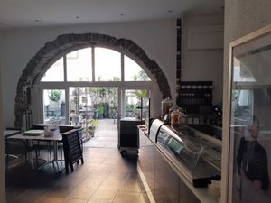 Courtyard seating at Caffè dell'Arte Boutique Rooms in Locarno