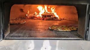 An exciting live-cooking show. at Pizza Wala  in Berlin