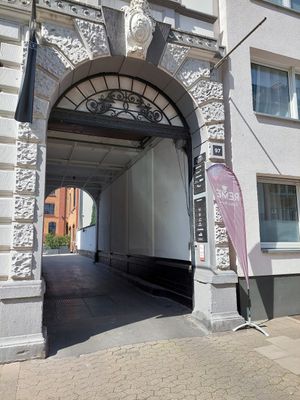 You enter here from the main street. Café is around the corner on the right. at Remé in Dusseldorf