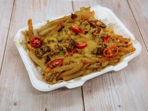 Loaded Fries
Melted CheeZe, CheeZe Sauce, Fresh Chilli, Mini Crispy Shroom, Oinkless Slice and onion all melted then drizzled with a choice of two sauces at The Vegan Kitchen in Birmingham