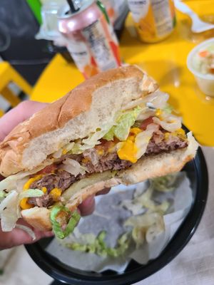 Single impossible burger with cheese, lettuce, tomato, grilled onions, mayo and mustard at Plant Based Burger Company in Maple Heights