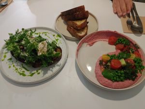 Hummus salad, mushroom tartine, and sourdough at Pinch Brunch Bar in Seoul