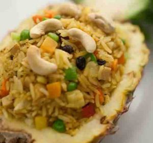 Khow Ob Sapparos (*GFO,MM,nuts) Scrumptious baked pineapple rice with cashew nuts & seasonal vegetables makes this meal a gourmet choice at Loving Hut in Richmond