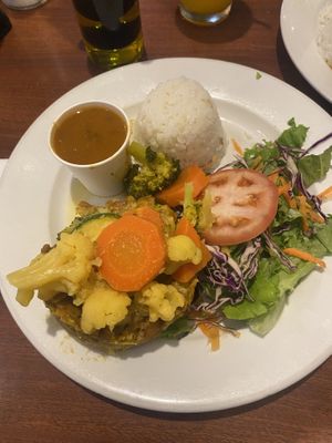 Mofongo (mashed plantain) with vegetables, side of rice and beans and green salad  at Café El Punto in San Juan