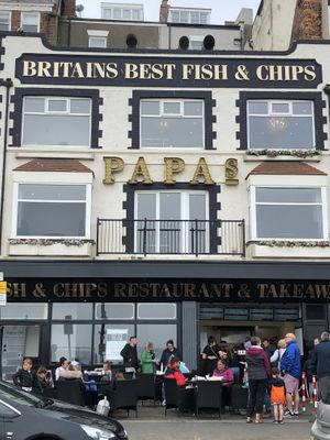 The outside showing seating at Papa's Fish & Chips in Scarborough