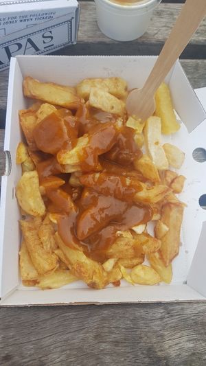 Chips and curry sauce at Papa's Fish & Chips in Scarborough