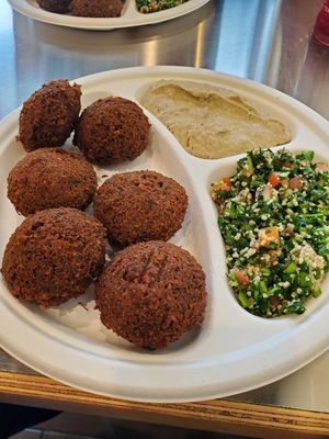 Falafel platter comes with two sides. Shown here: baba ganoush and tabouleh. at Quick Chick in Mechanicsburg