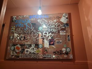 Bathroom graffiti mirrors at Comet Ping Pong in Washington