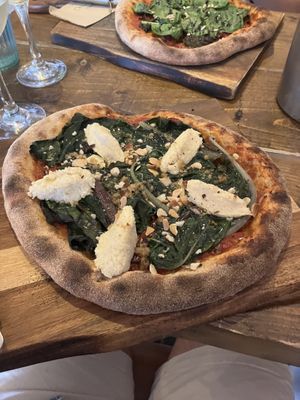 Wilted greens, almond ricotta and dukkah pizza   at Hoogah Cafe in Swansea