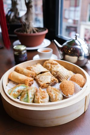 Vegan dumpling mix: 2 veggie spring rolls, 2 soybean sheet rolls, 2 spinach dumpling 2 shiitake dumpling & 2 sesame balls filled with red bean paste at Full Moon City in The Hague