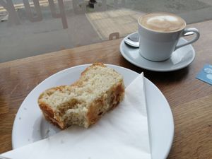 Lemon cake and flat white with oat milk at The Tiny Bakery in Leicester