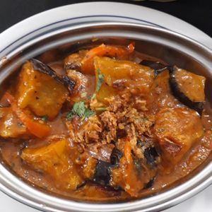 Aubergines with herbs and spices + bread with almonds and sultanas at Taj Indian Restaurant in Girona