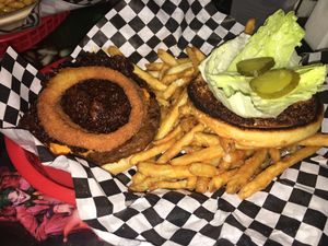 The Memphis Burger with BBQ pulled “pork”, onion rings, lettuce, pickles, and vegan cheese sauce. at Doomie's Home Cookin' in Hollywood
