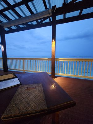 Deck is literally on the lagoon so you can watch the fish while you wait for your food at Captain Andy's Bar & Grill in Rarotonga