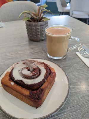 Vegan cinnamon roll and dirty chai with oat milk at Trellis Coffee Shop in Ellon