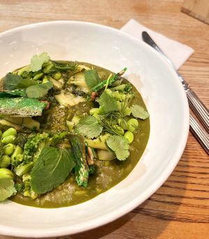 Vegan bulgur risotto with green vegetables: bulgur porridge in green sauce with pickled edamame beans and broccoli at Coffee Cult - Sovetskaya in Tula