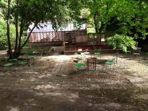 Drinking coffee while the sun is shining through the leaves of the trees! at Ulriksdals Trädgård Arts & Crafts in Kivik