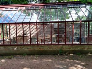 The Orangerie, a lovely inside seating area to enjoy your coffee and sweets (or a nice sandwich) at Ulriksdals Trädgård Arts & Crafts in Kivik