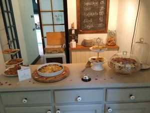 Café from the inside with some prices on the board. at Ulriksdals Trädgård Arts & Crafts in Kivik