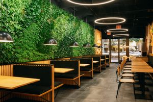 Enjoy a respite from city life under a lush living plant wall. at NuLeaf in New York City