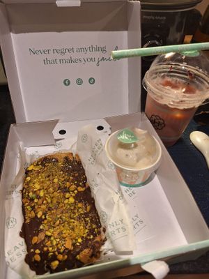 Vegan cookie dough with dark chocolate, pistachios and vanilla gelato. Rose and lychee latte (oat milk).  at Heavenly Desserts in Leeds