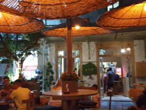 Zoe by night sitting outside at Zoe in Ermoupoli