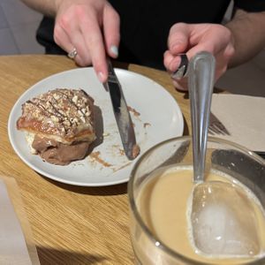 banana donut and iced coffee  at Delish Vegan Doughnuts - Malasaña in Madrid