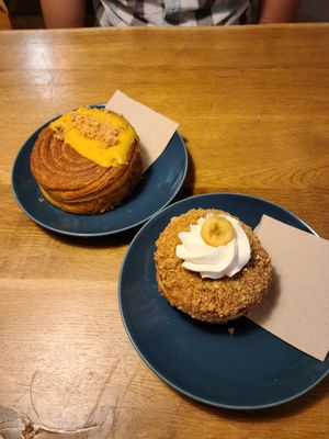 Mango Macadamia Pastry (top left) and Banana Pudding Salted Pretzel Donut (bottom right) at Delish Vegan Doughnuts - Malasaña in Madrid