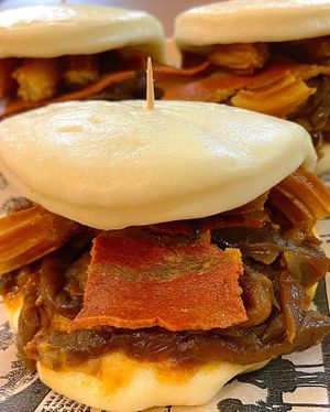Baos with caramelized onion, vegan bacon and churros at FinaFilipina in Madrid