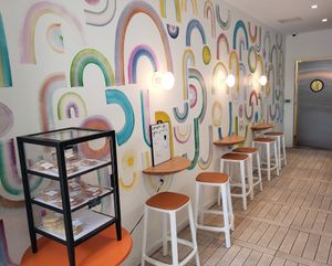 Cute rainbow mural inside at RAWGIRLS Downtown in Memphis